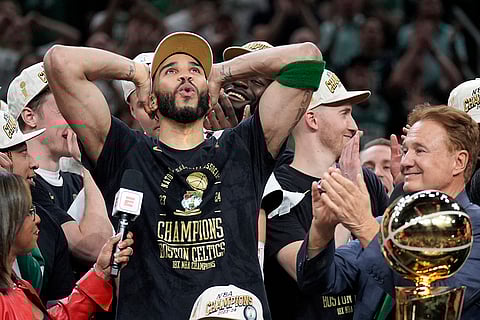 Jayson Tatum celebrates next to Celtics co-owner Stephen Pagliuca